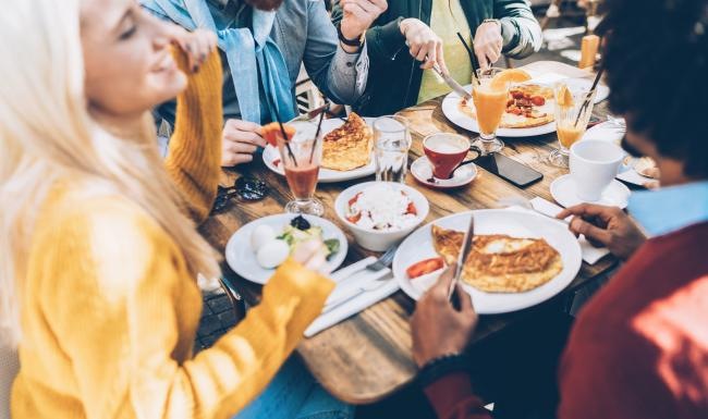 a group of people eating at a table