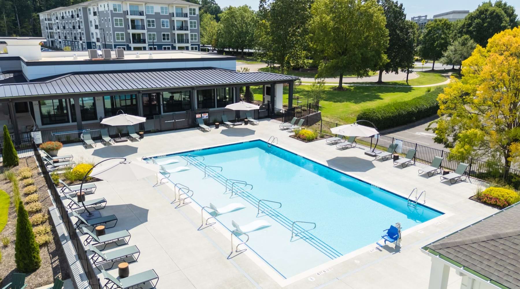 Pool Deck by Clubhouse surrounded by Trees